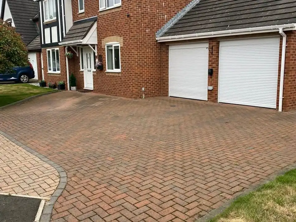 Before double garage block paving driveway clean