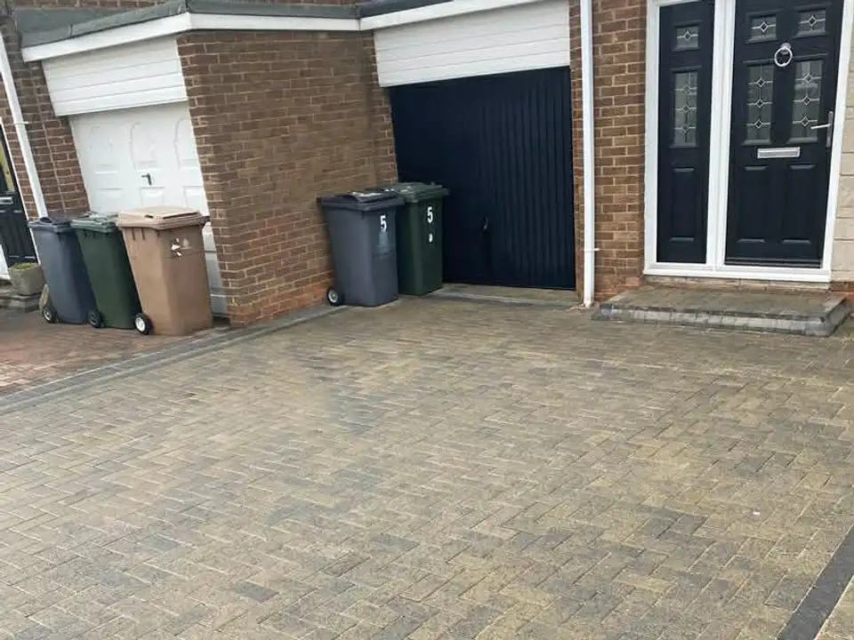 After twin garage block paving driveway clean