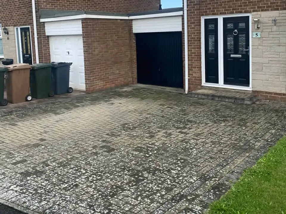 Before twin garage block paving driveway clean